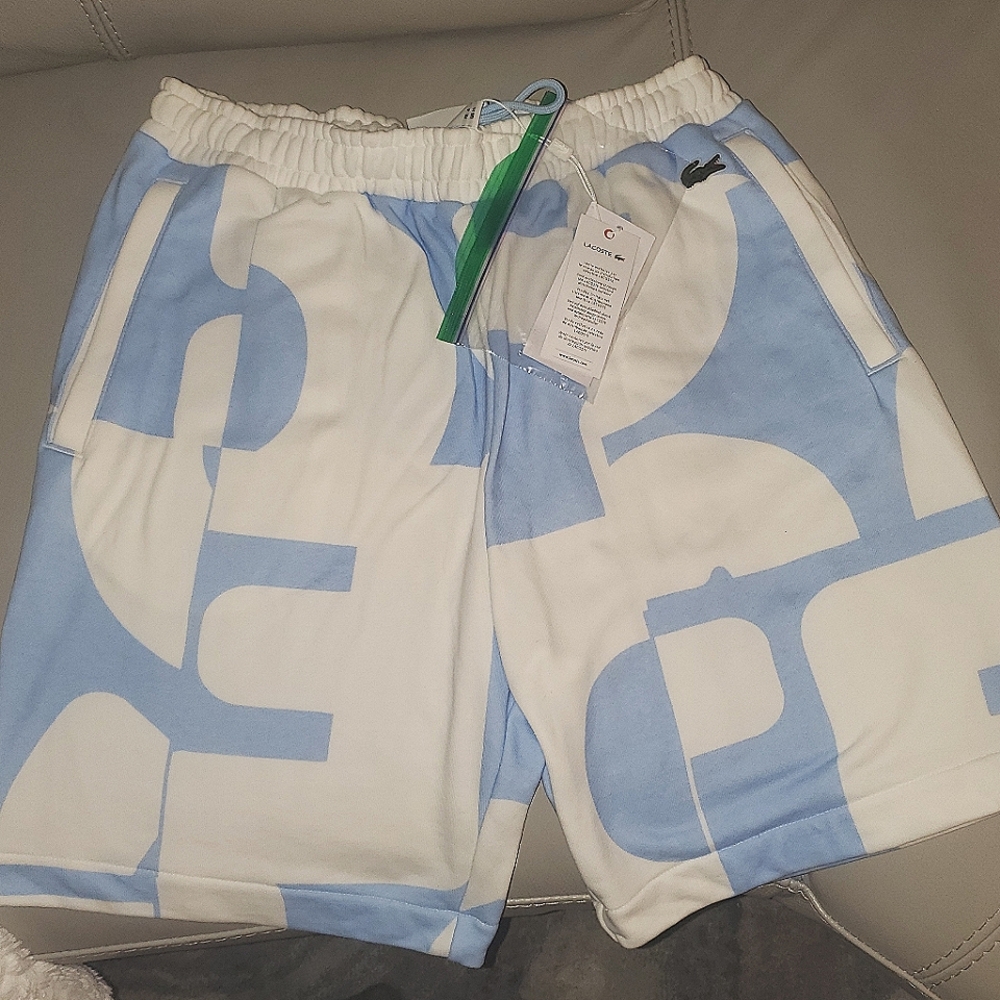 Lacoste Blue and White Heritage shorts, side medium, brand new with tags.
